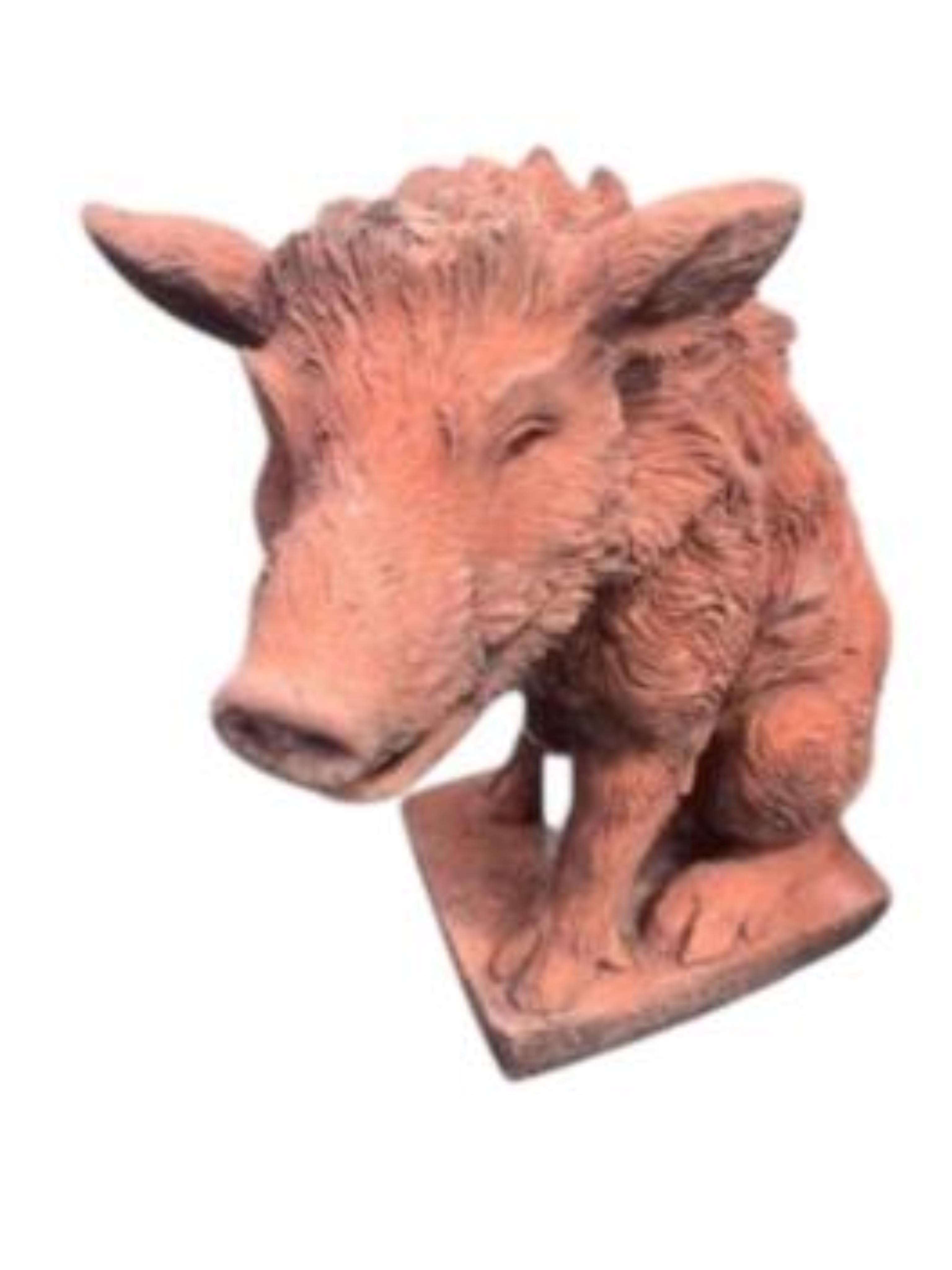 A pair of terracotta seated wild boar garden ornaments